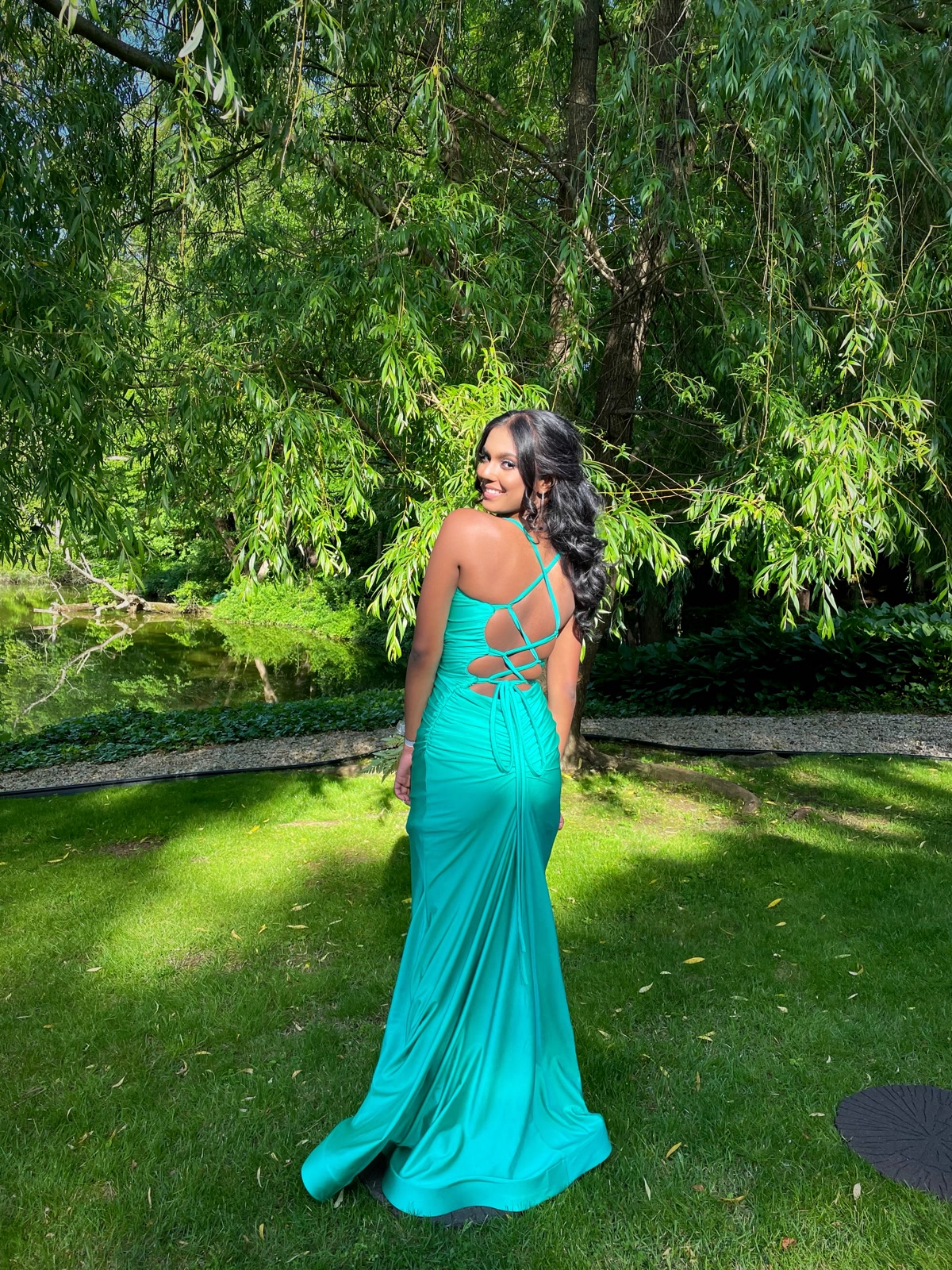 Prom styling with voluminous boho waves and teal gown
